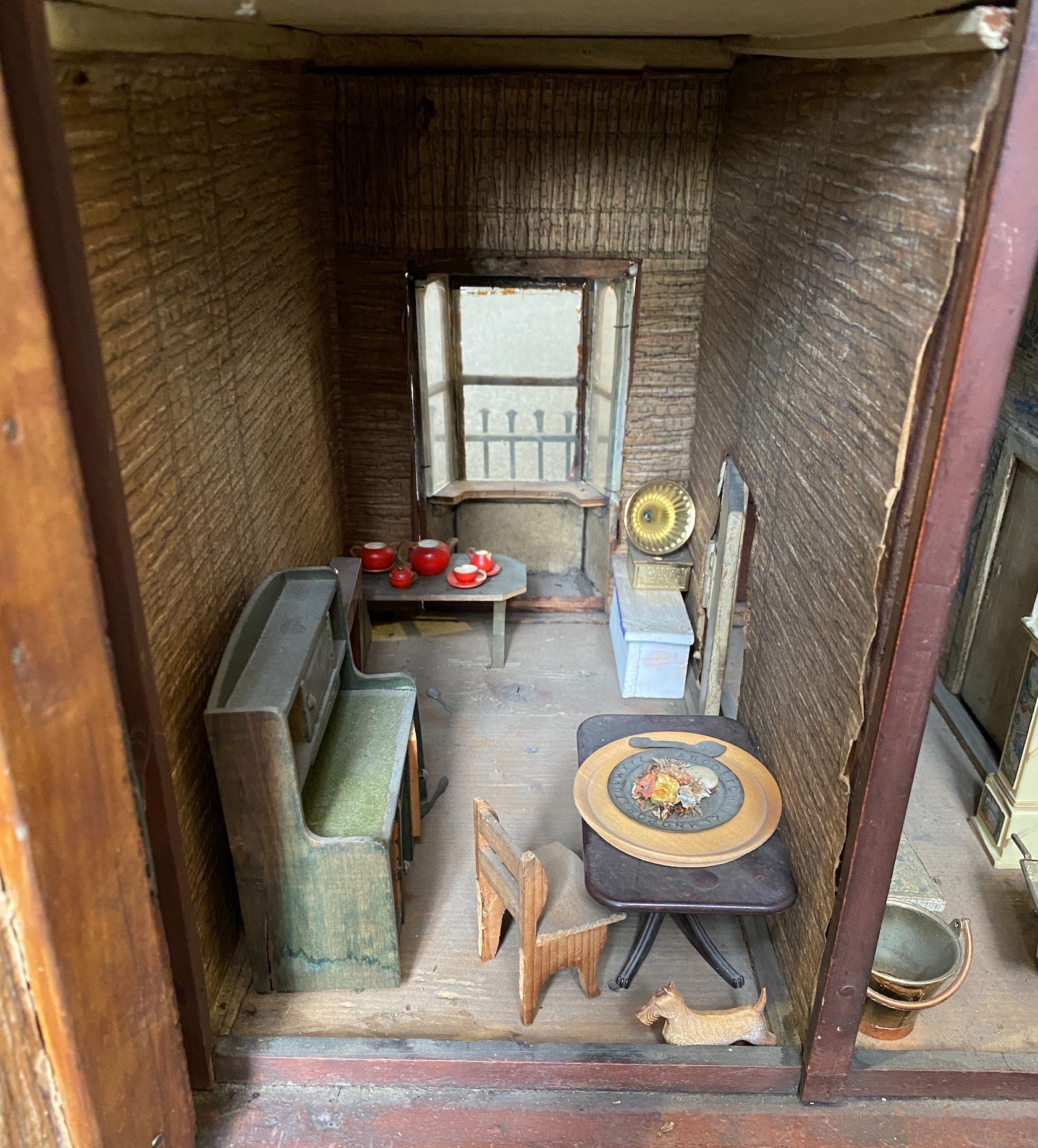 A back-opening furnished English dolls’ house, late 19th century, 74cm high